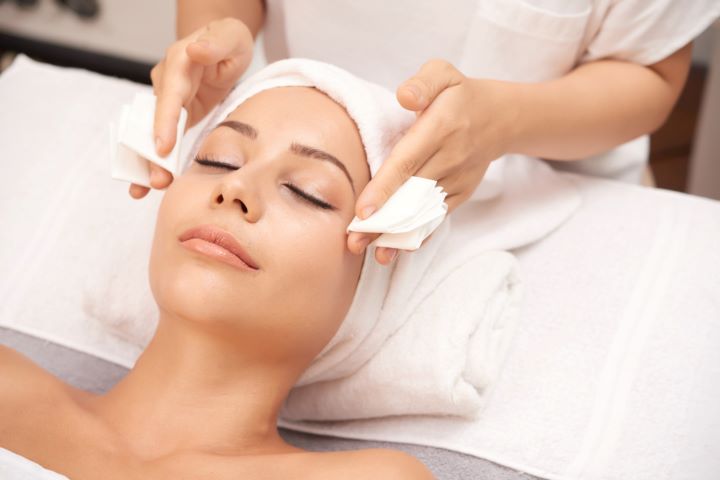attractive woman getting face beauty procedures spa salon